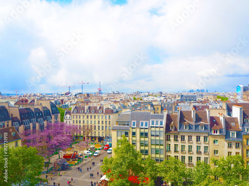 Aerial city view of beautiful buildings and the Eiffel Tower on the horizon in spring in Paris photo