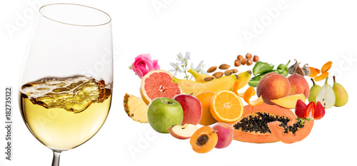 Fototapeta Naklejka Na Ścianę i Meble -  White wine fruit and plant aromas next to wine glass.