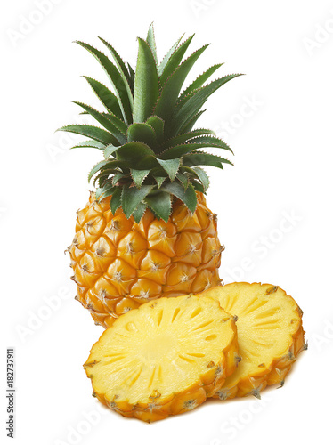 Small pineapple and round slices isolated on white background