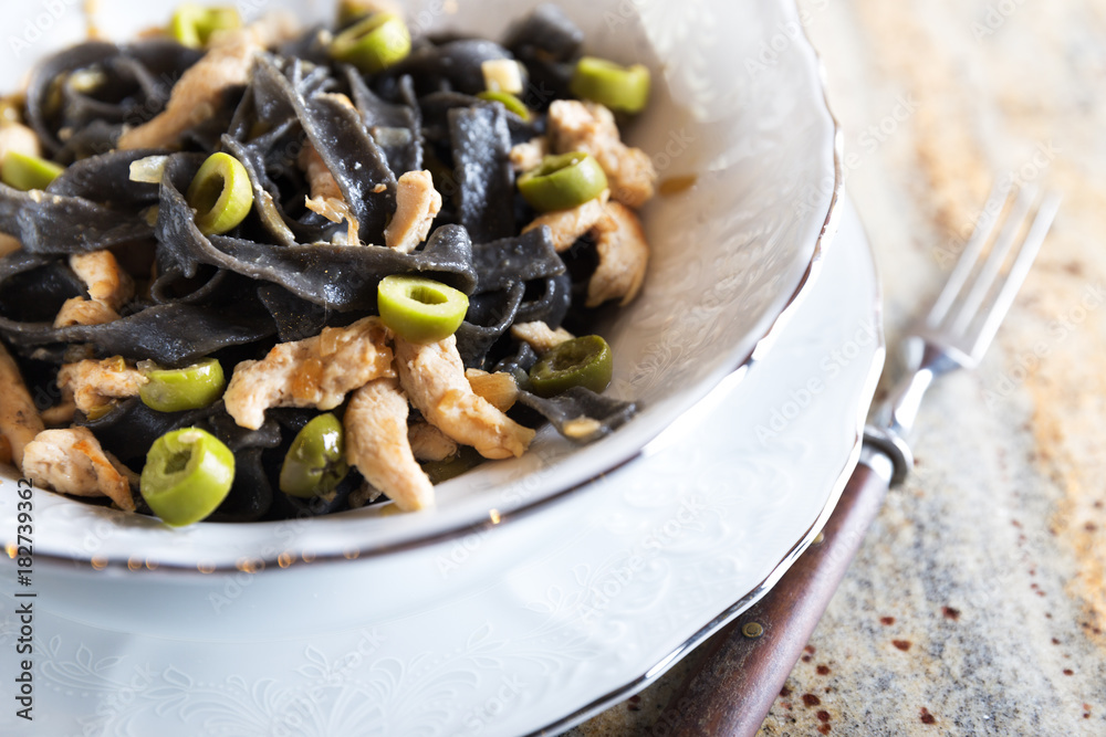 Black ink pasta with chicken and green olives Black ink pasta with chicken and green olives