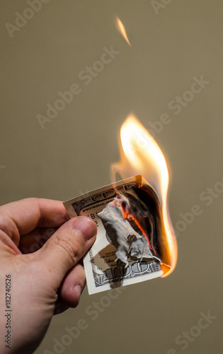 Burning one hundret dollar photo