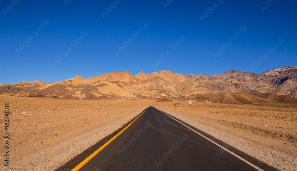 Road through the desert of Death Valley in California Road through the desert of Death Valley in California