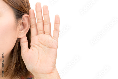 Asian woman hold her hand near her ear and listening