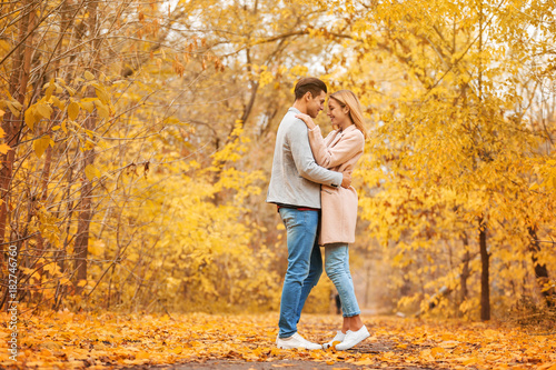 Young couple in park on autumn day © Africa Studio