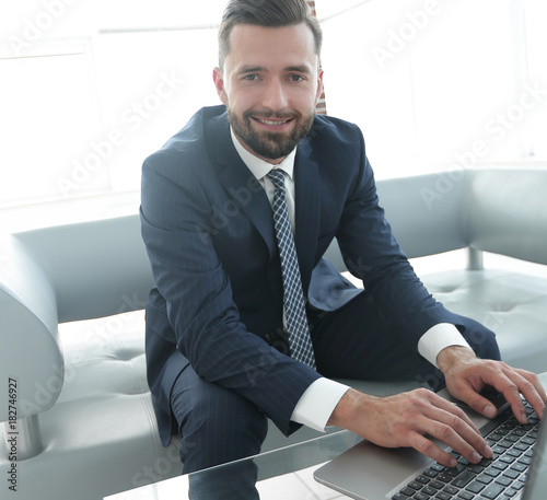 employee of the company typing text on the laptop keyboard © ASDF