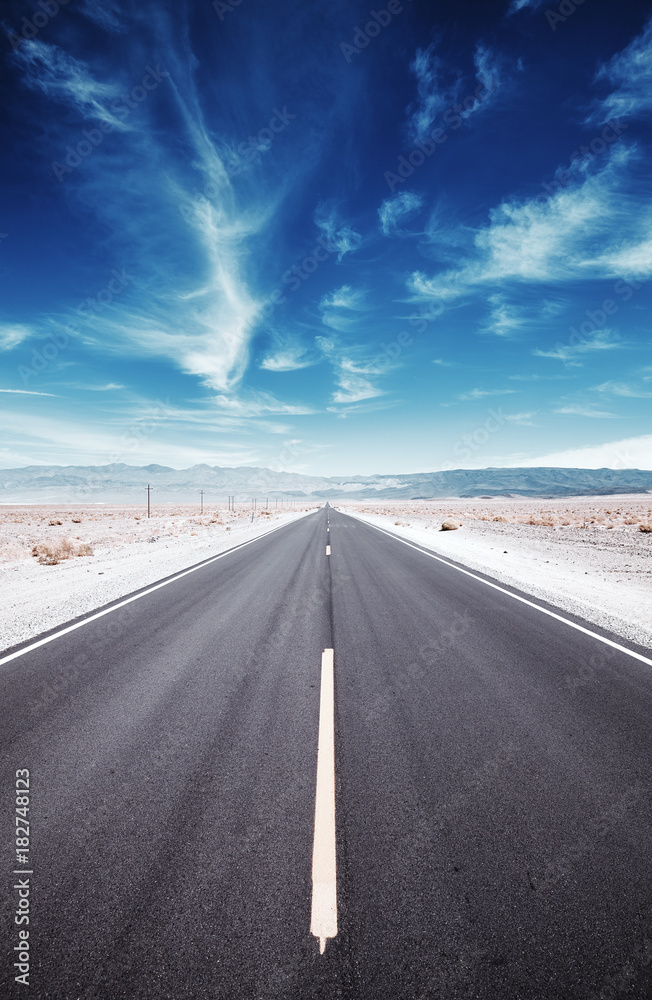 Naklejka premium Death Valley desert road, travel concept, color toned picture, USA.