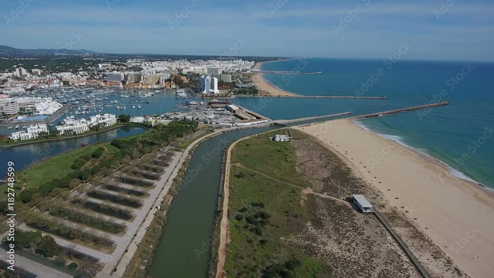 Aerial. Shooting a video from the sky with the drone of a tourist town Vilamoura. Algarve Aerial. Shooting a video from the sky with the drone of a tourist town Vilamoura. Algarve