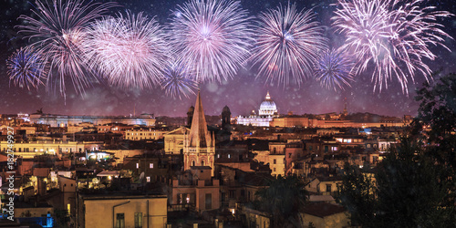 Photography Night panorama of Rome with fireworks on the black sky , Italy