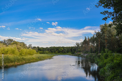 Fototapeta Naklejka Na Ścianę i Meble -  Clouds, blue sky, river - summer landscape.