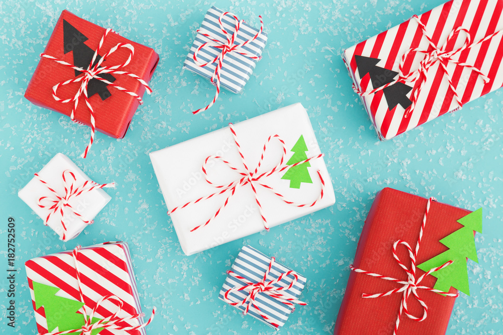 Fototapeta premium Cute Christmas gift boxes flat lay. Christmas concept.
