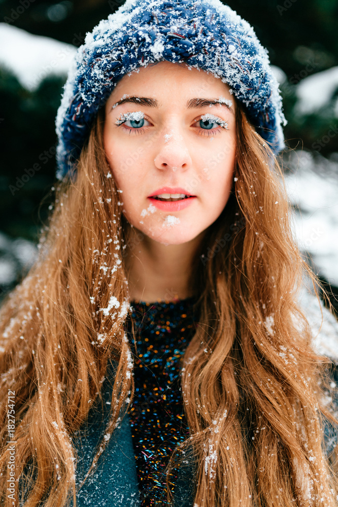 Odd foolish bizarre fun closeup portrait. Unique crazy girl. Woman snow