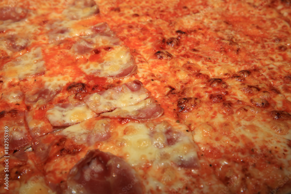 Fresh italian Pizza with Ham, Salami, Tomato and Cheese Fresh italian Pizza with Ham, Salami, Tomato and Cheese