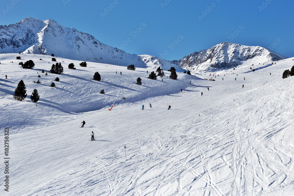 The ski slope with figures of skiers The ski slope with figures of skiers