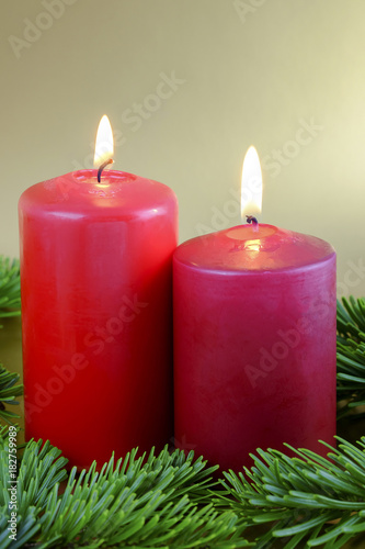 Christmas composition with two red candles.