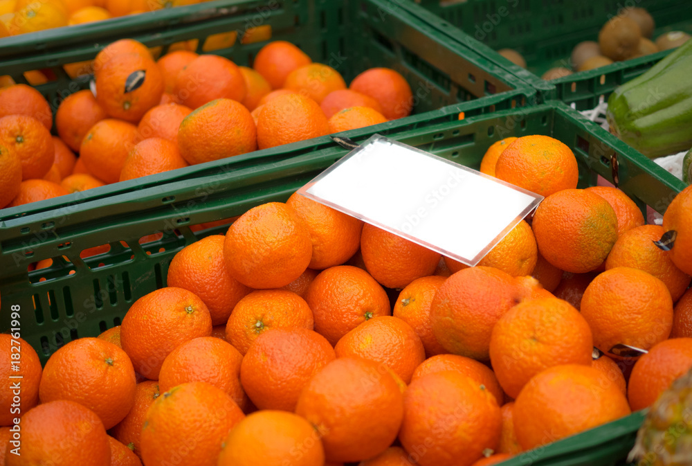 clementines at market with empty label