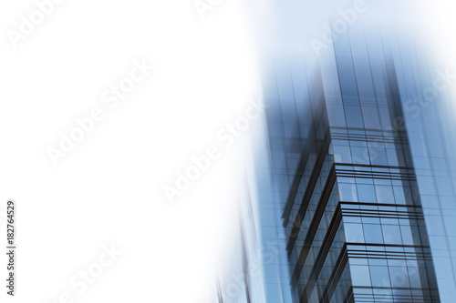 Abstract business modern city urban futuristic architecture background. Real estate concept, motion blur, reflection in glass of high rise skyscraper facade, toned blue picture with bokeh