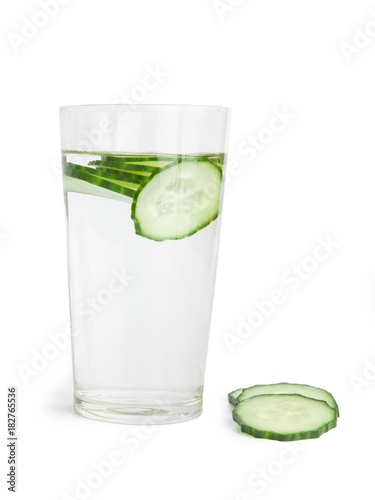 Glass of freshness water with cucumber slices, isolated on a white background