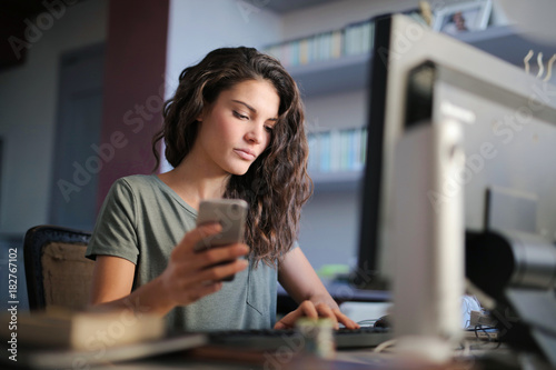 Beautiful young woman using technology
