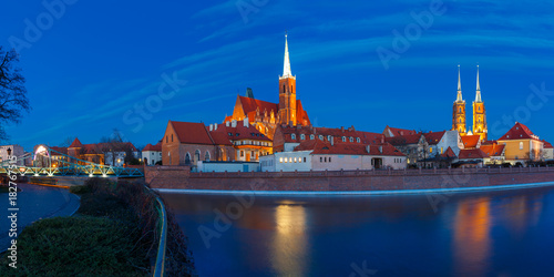Panorama of Cathedral Island or Ostrow Tumski with Cathedral of St. John and church of the Holy Cross and St. Bartholomew at night in Wroclaw, Poland