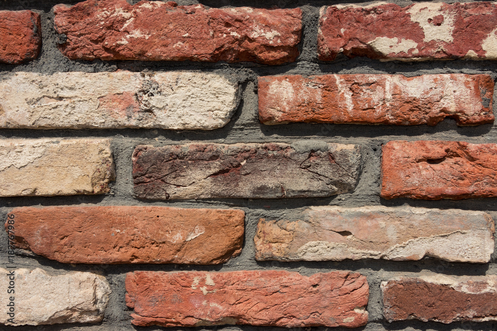 Fototapeta premium background texture old wall with red brick at an angle close-up close-up