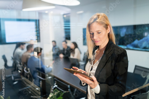 Beautiful businesswoman using digital tablet in office