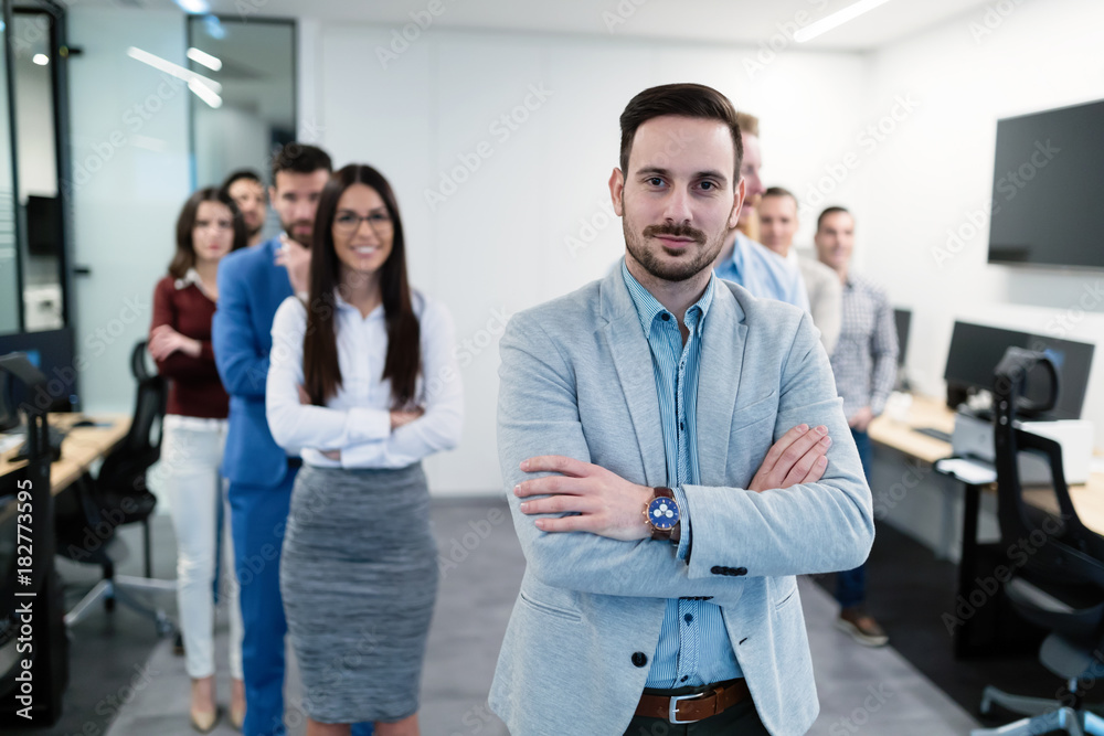 Group picture of business team posing in office Group picture of business team posing in office