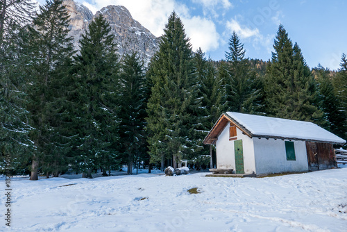 Small house in the mountains covered with snow © DarwelShots