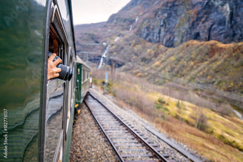 Taking pictures of landscape from a train window