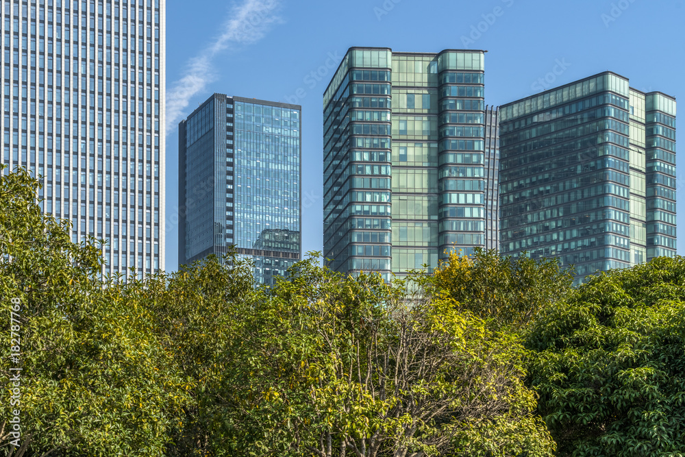 modern office buildings with green trees