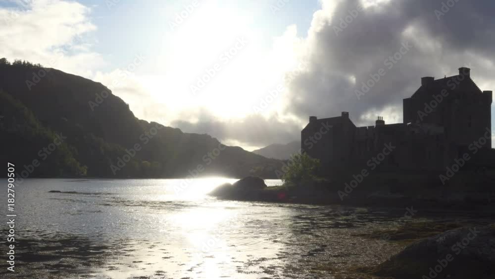 Scottish Castle on the lake at Sunset Scottish Castle on the lake at Sunset