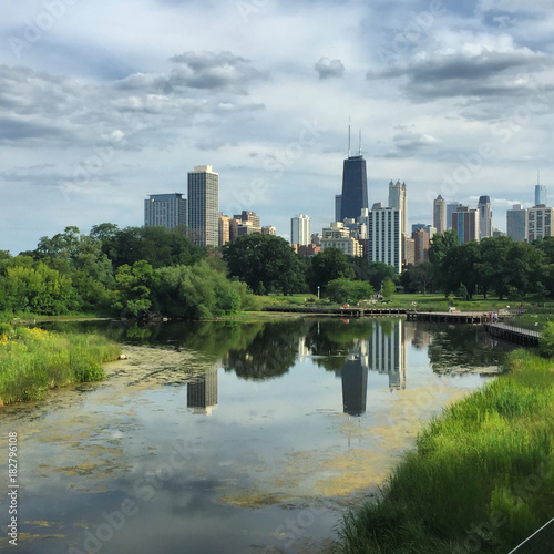 Chicago skyline reflected from a pond in a park