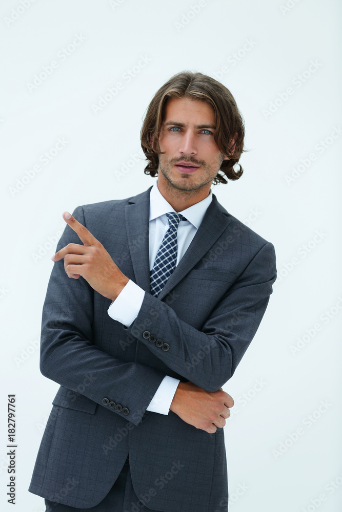 a young and handsome businessman pointing up with his finger a young and handsome businessman pointing up with his finger