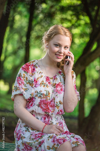 Young beautiful girl smiling and talking on the phone