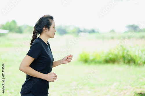 Young woman jogging in nature