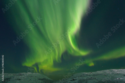 Winter in the sky the northern lights,aurora. © Moroshka