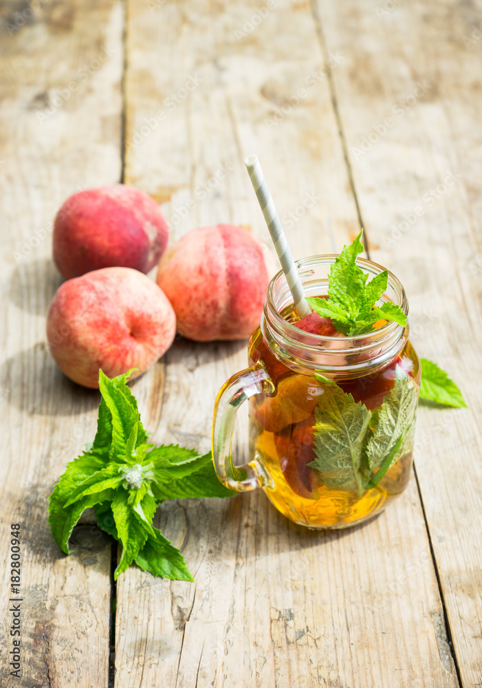 Glass of sweet peach iced tea Glass of sweet peach iced tea