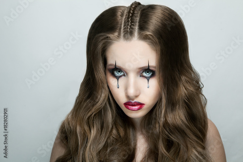 Woman with stylish gothic Halloween makeup