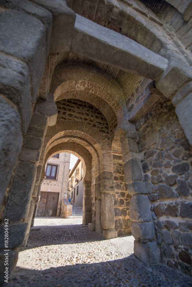 inside ancient building Alfonso VI Gate, landmark and ancient age monument from tenth century, one of the pedestrian public access to Toledo city, Spain, Europe
