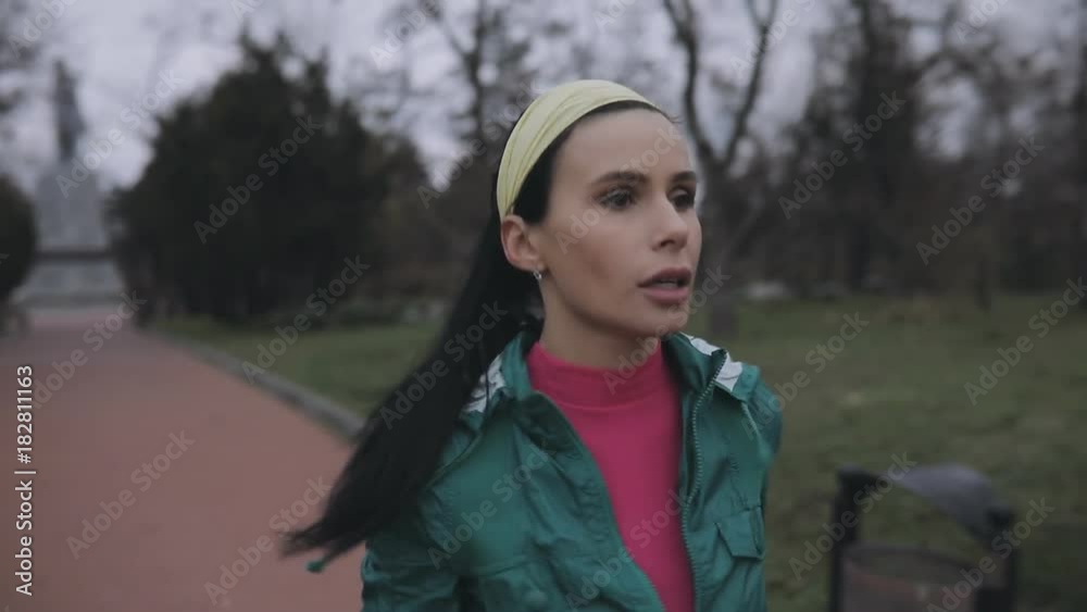 Woman jogging outdoor in cold winter day Woman jogging outdoor in cold winter day