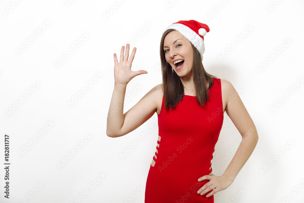 Beautiful caucasian young happy woman with charming smile wearing red dress and Christmas hat showing thumbs five on white background. Santa girl isolated portrait. New Year holiday 2018 concept Beautiful caucasian young happy woman with charming smile wearing red dress and Christmas hat showing thumbs five on white background. Santa girl isolated portrait. New Year holiday 2018 concept