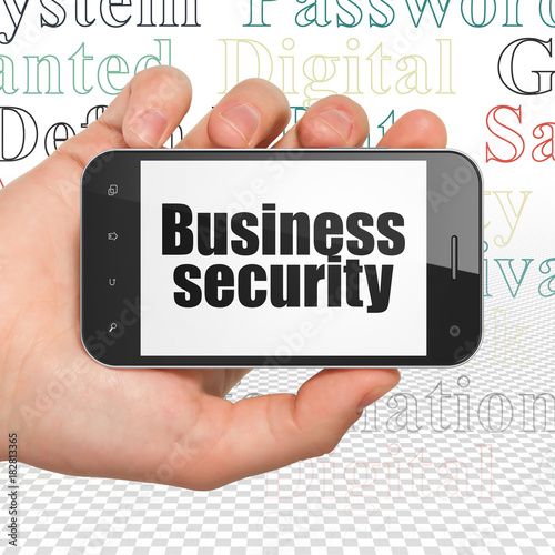 Privacy concept: Hand Holding Smartphone with  black text Business Security on display,  Tag Cloud background, 3D rendering