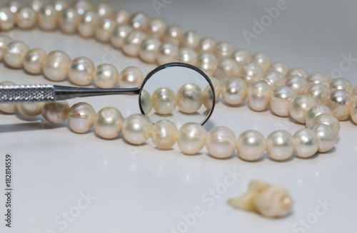 bad rotten tooth pulled out and is opposite the dental mirror and dazzling pearls
