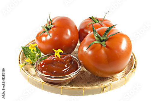 tomatoes and sauce in bamboo tray photo