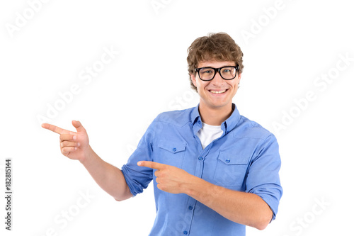 Man in glasses points with his finger to the side.