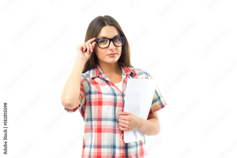 Beautiful young brunette woman in glasses and on a white background. Pretty cheerful student woman. Beautiful young brunette woman in glasses and on a white background. Pretty cheerful student woman.