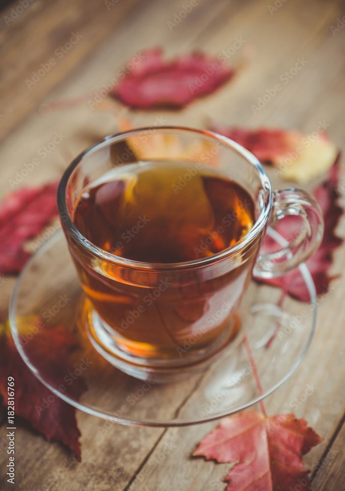 Cup of tea on the rustic background with autumn decoration. Selective focus. Shallow depth of field. Cup of tea on the rustic background with autumn decoration. Selective focus. Shallow depth of field.
