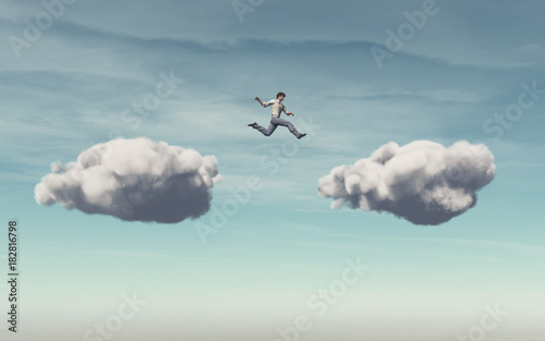 Businessman jumps on a cloud