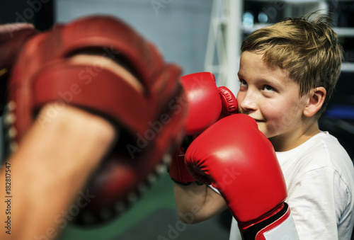 Boy Boxing Training Punch Mitts Exercise Concept © Rawpixel.com