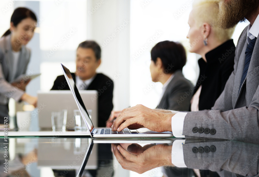 Business people working together in an office Business people working together in an office