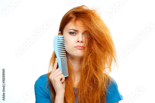 2043135 Hair, hairstyle, girl holding a comb, girl on a white isolated background